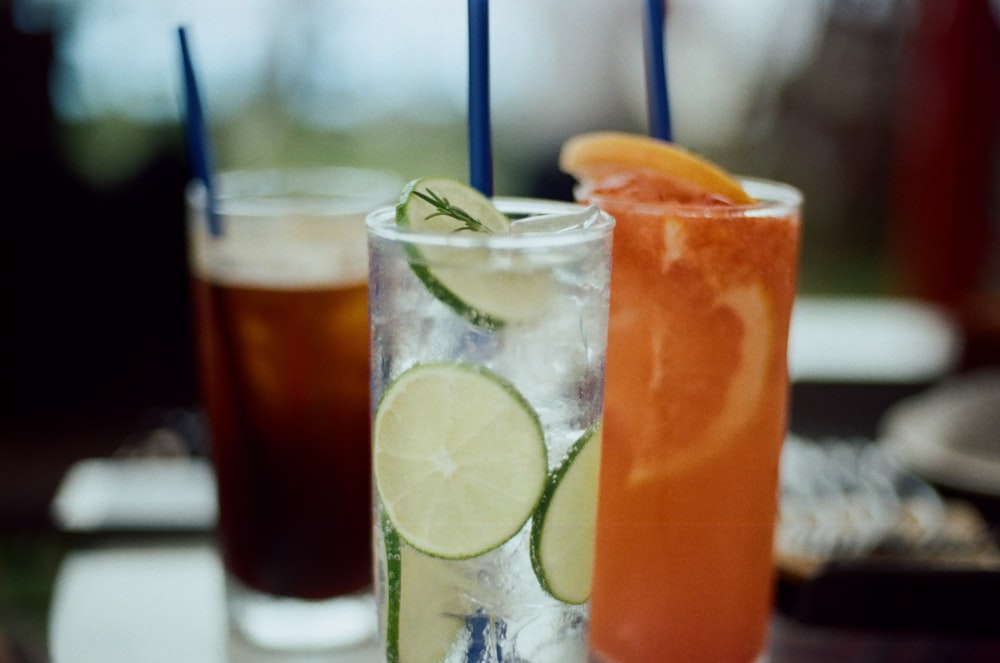 a group of drinks with limes and limes