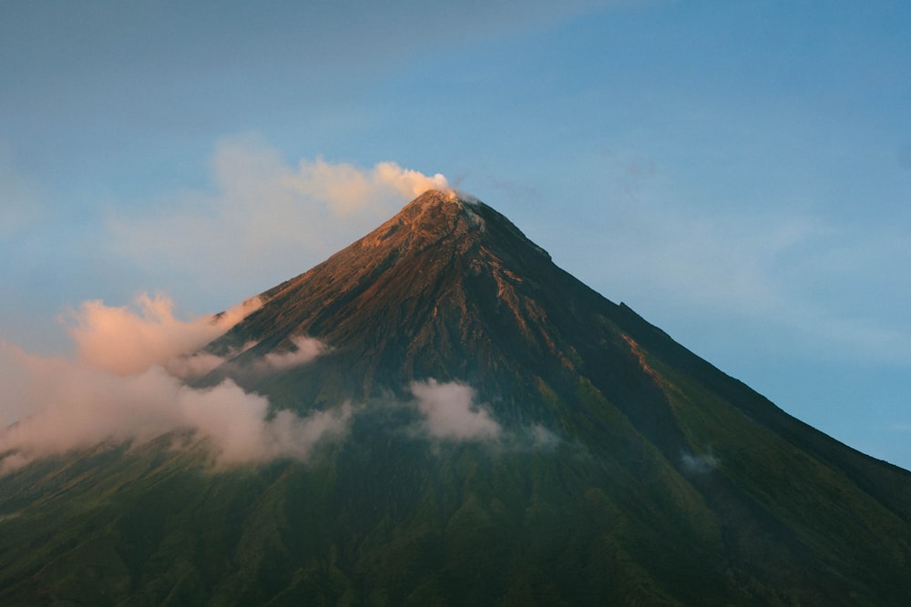 a mountain with clouds