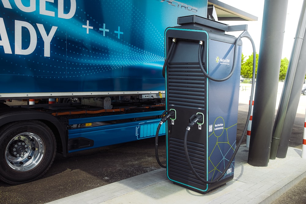 a blue truck with a door open