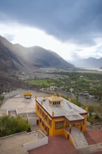 a building with a mountain in the background
