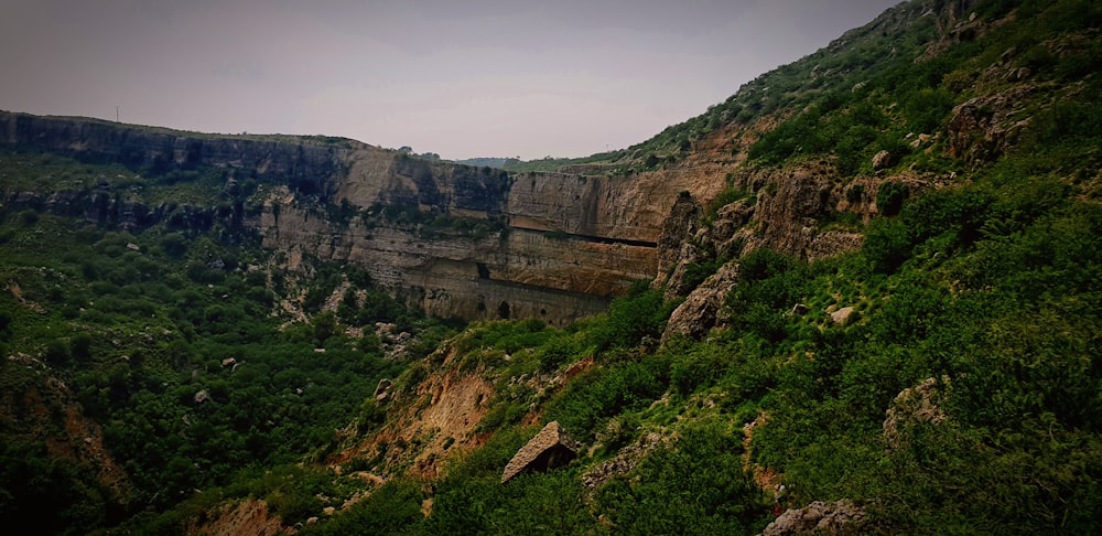 a stone bridge over a valley