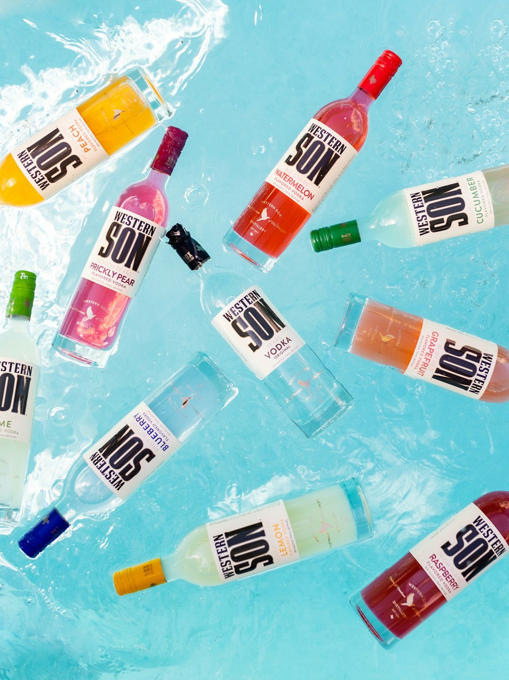 a group of bottles in a tub