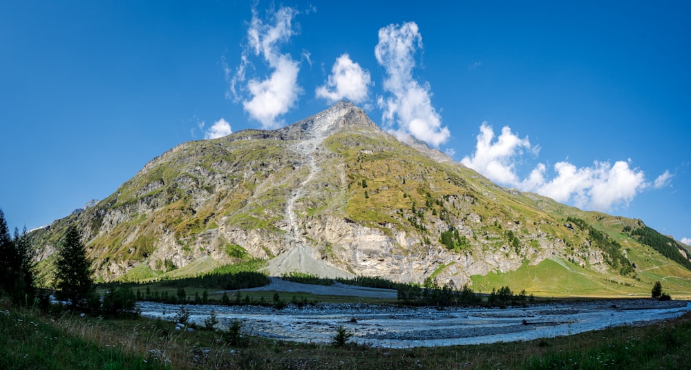 a mountain with a body of water in front of it