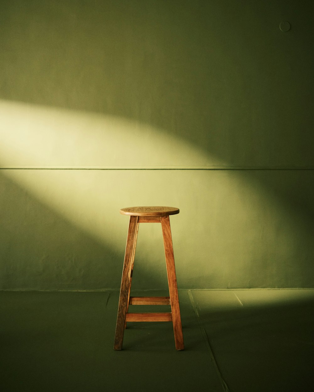 a stool against a wall