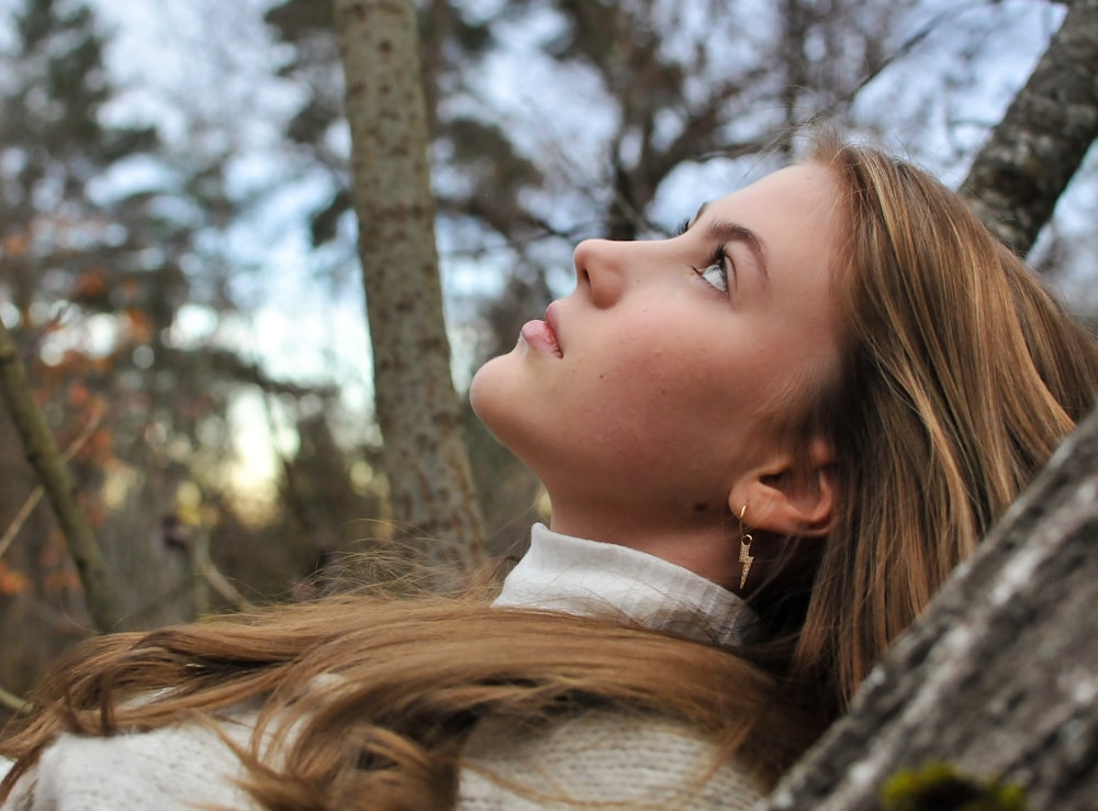 a person with the hair blowing in the wind