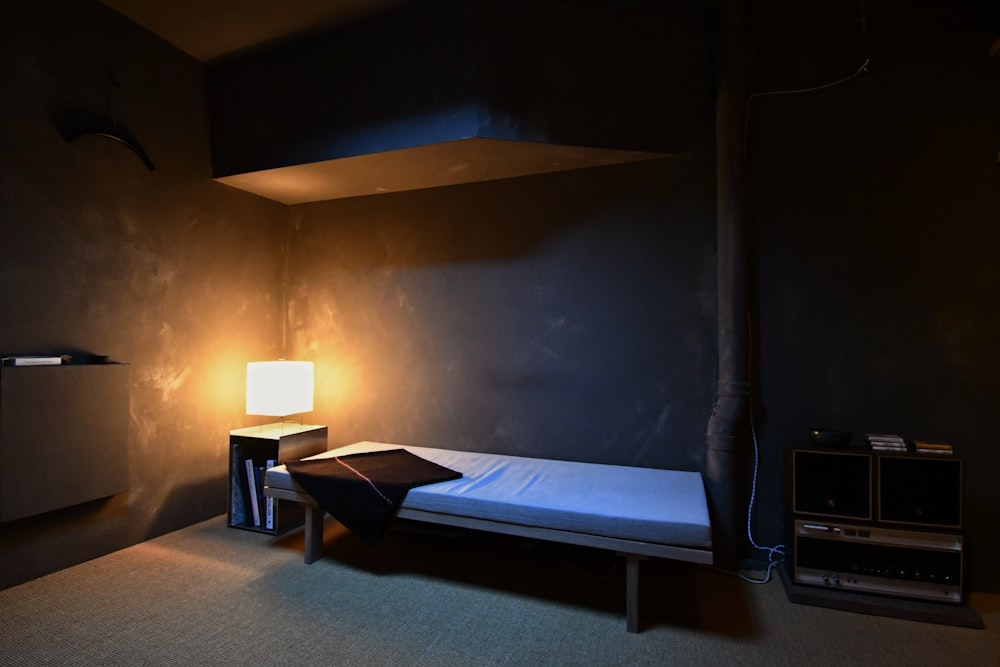a bed and a lamp in a room