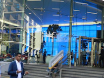 A sparkling clean commercial building entrance with blue accents reflecting professionalism.