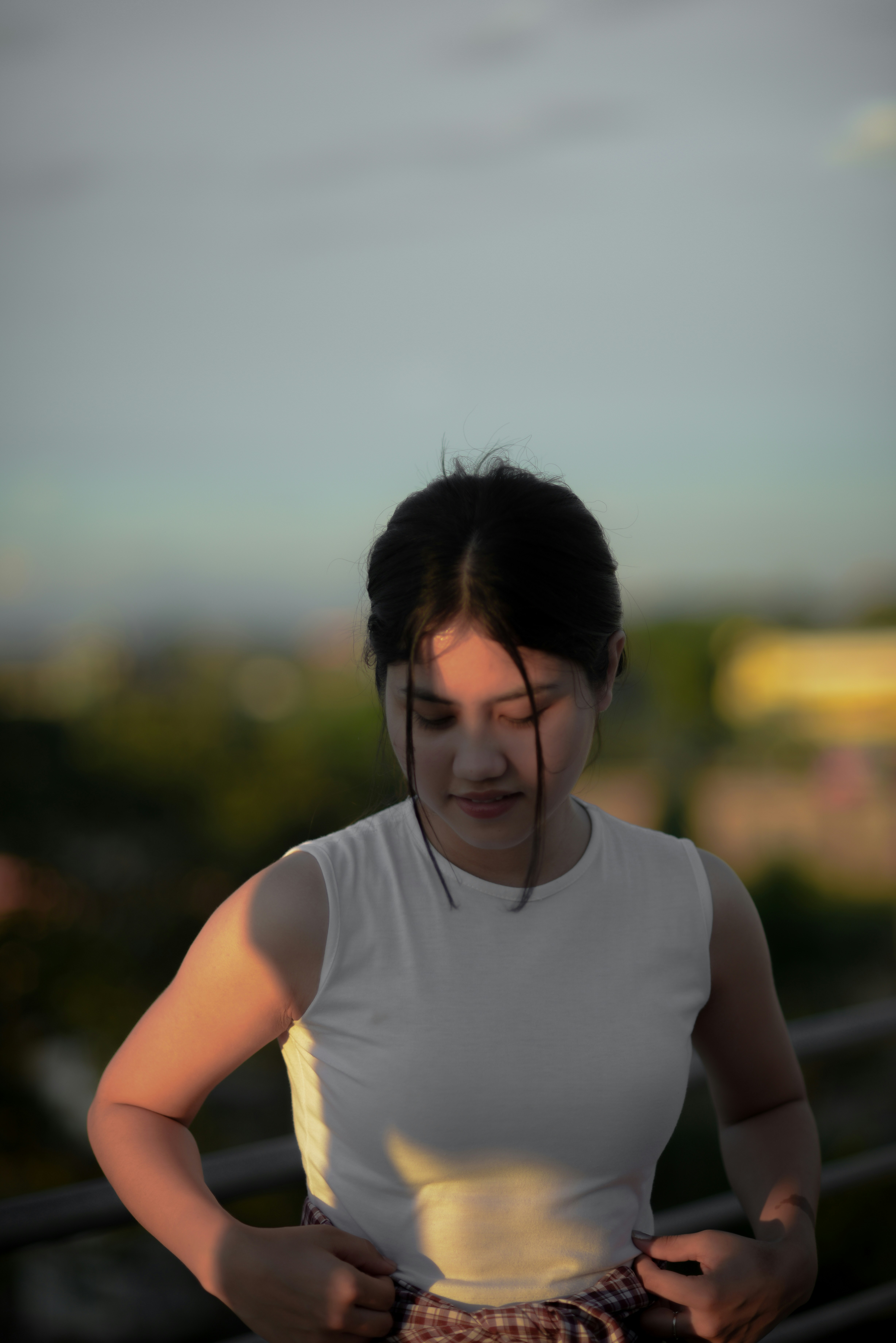 a person with a white tank top