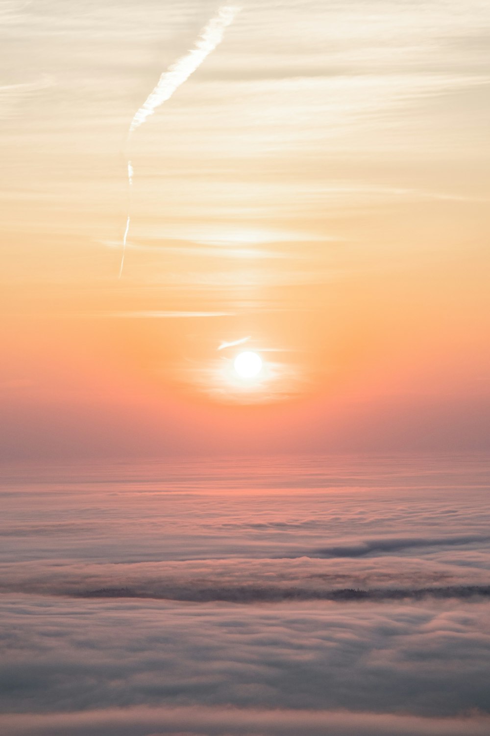 a sunset over a body of water