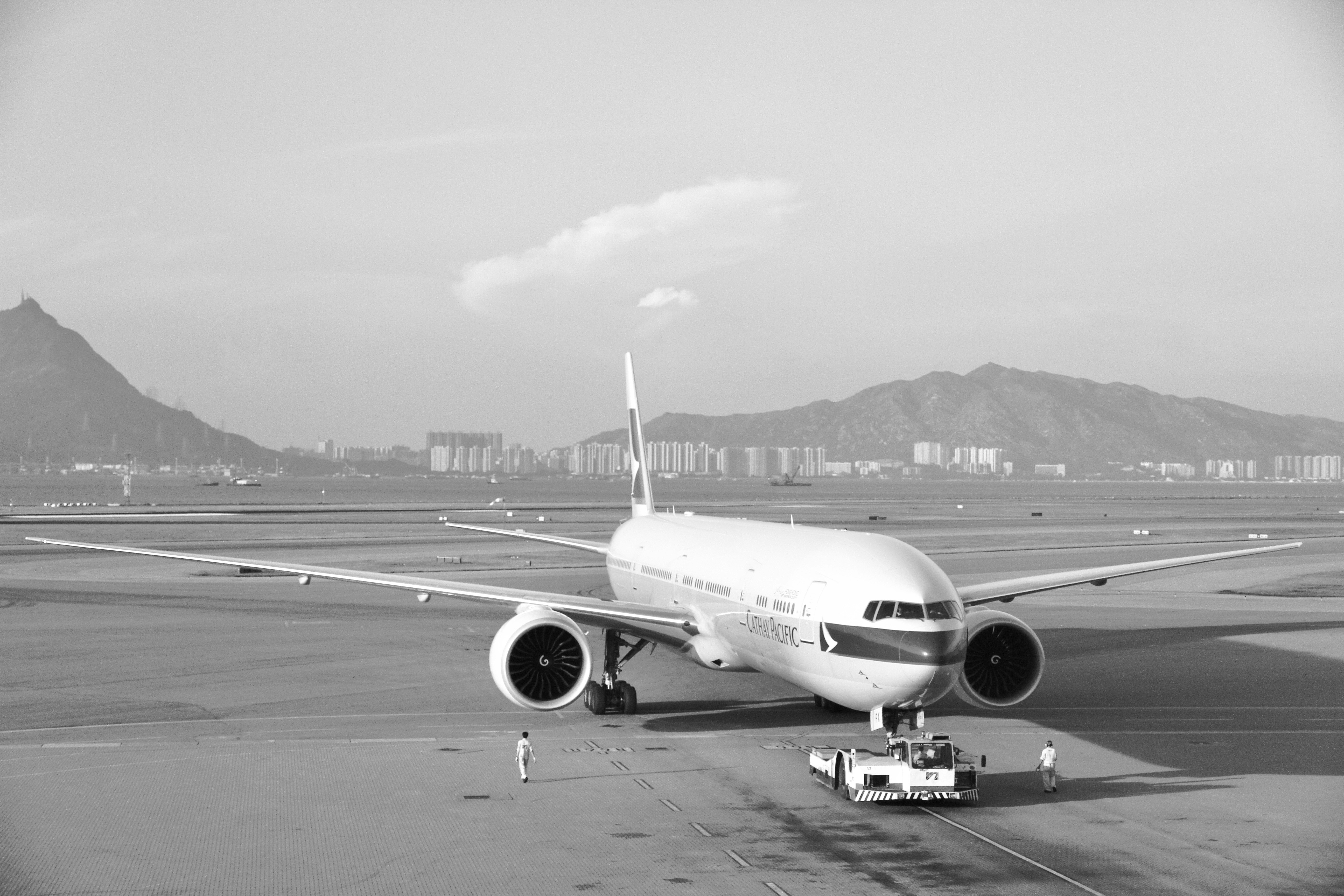 an airplane on the runway, Captured from the International terminal of Hong Kong Airport. Cathay Pacific aircraft getting ready to take off.