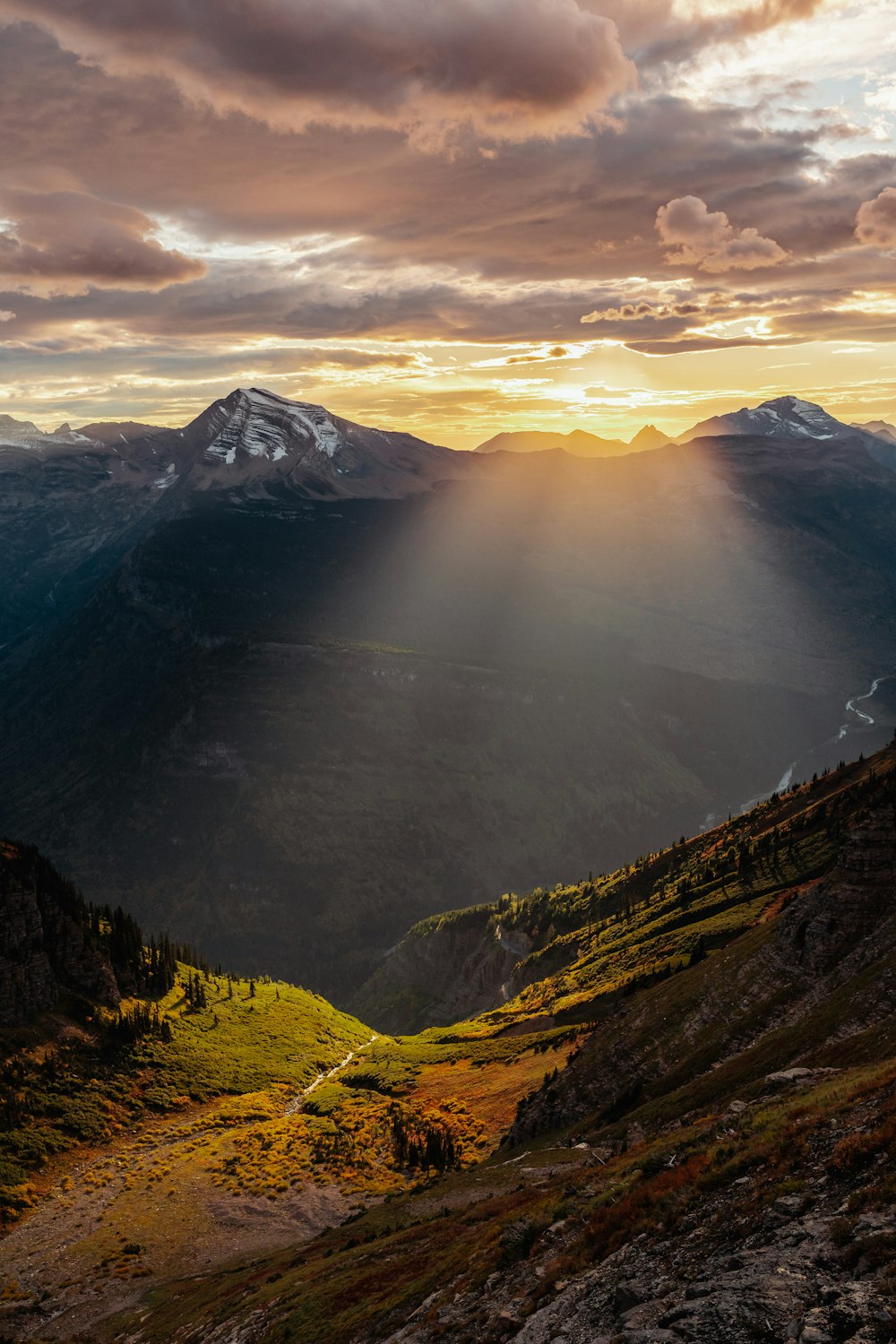 a valley with a mountain in the distance