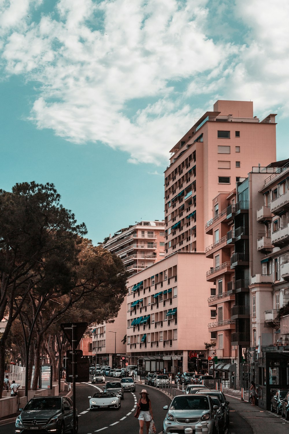 a street with cars and buildings on either side of it