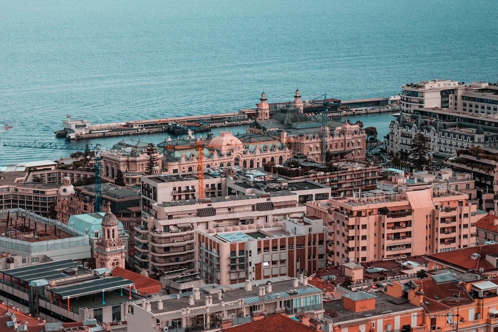 a city with a body of water in the background