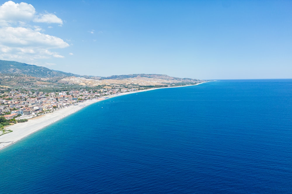 a beach with a town by it