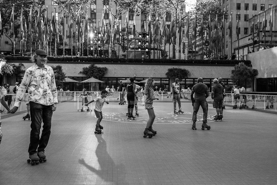 People skating together in an urban public space