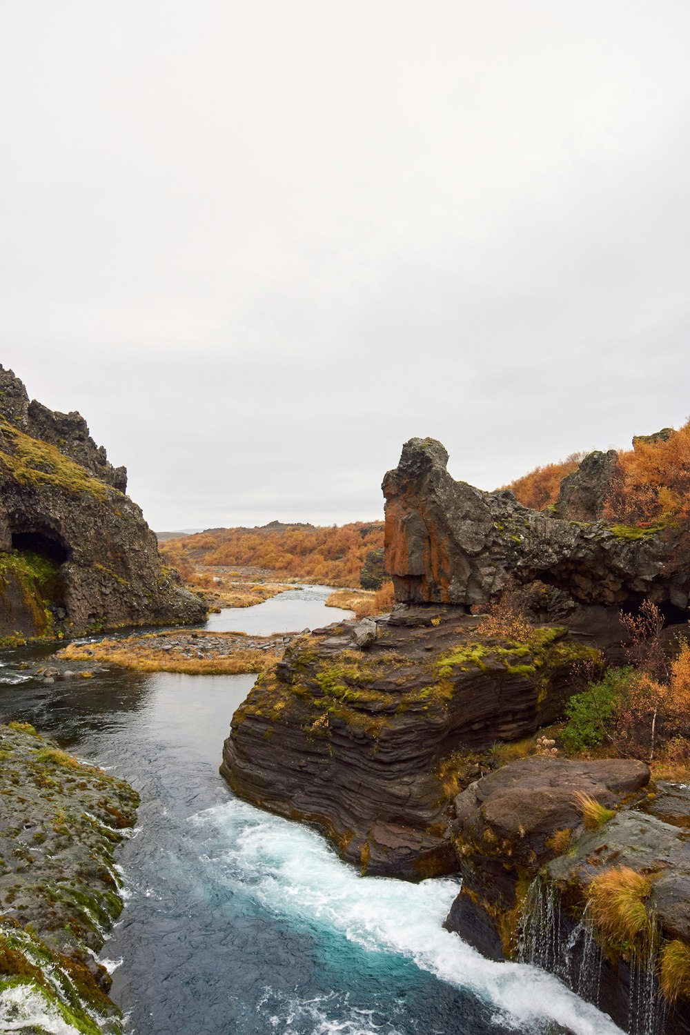 a river flowing between rocky cliffs