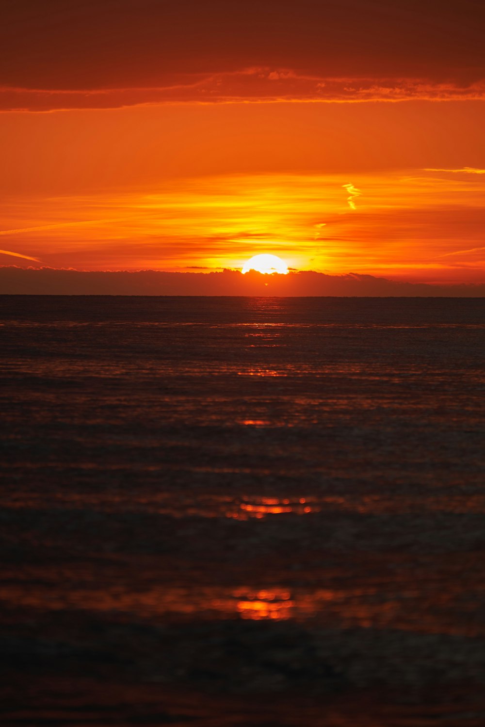 a sunset over a body of water