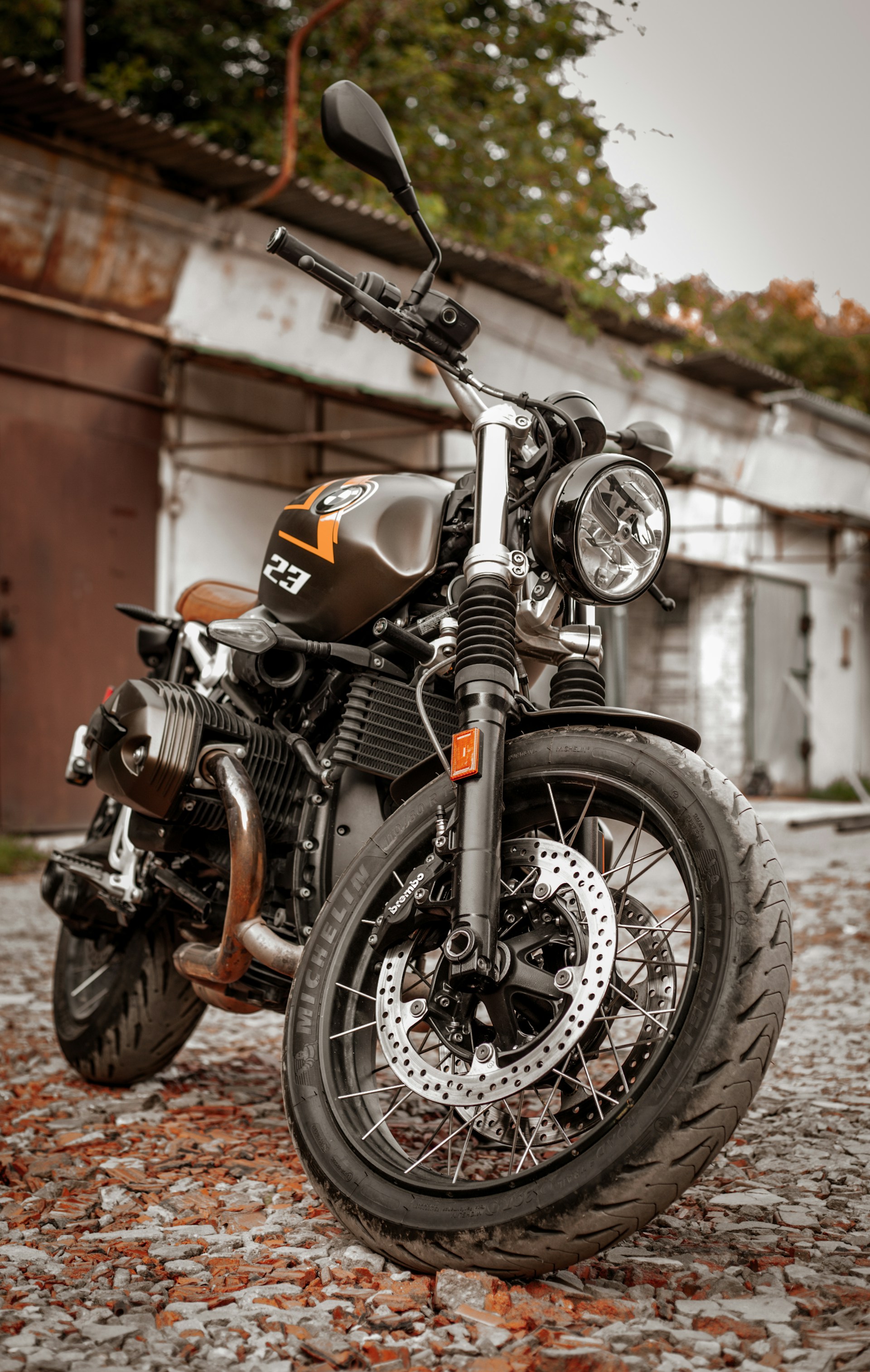 a motorcycle parked on a brick road