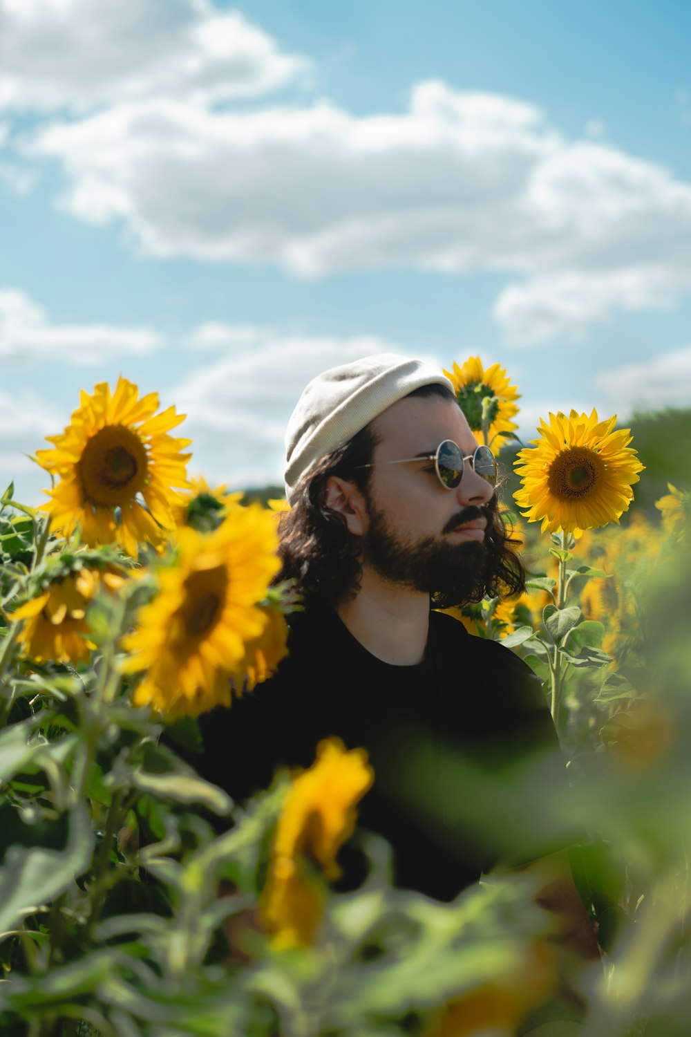 a person in a field of sunflowers