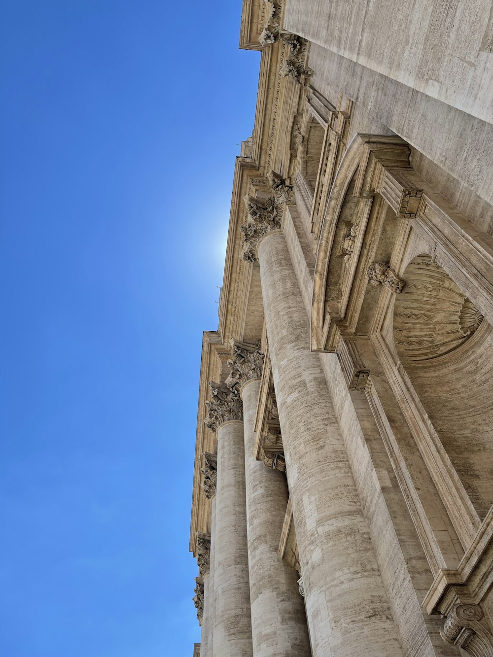 a stone building with a blue sky