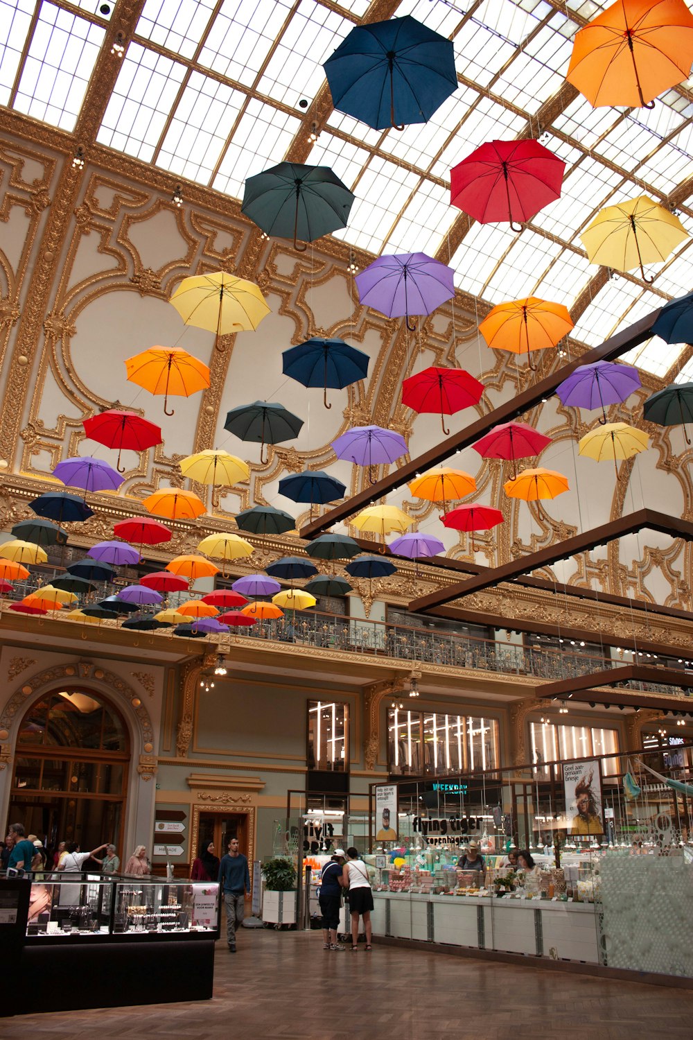 a large room with many umbrellas