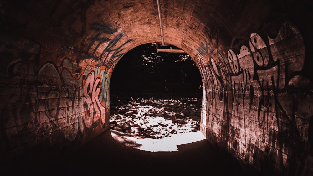 a tunnel with graffiti