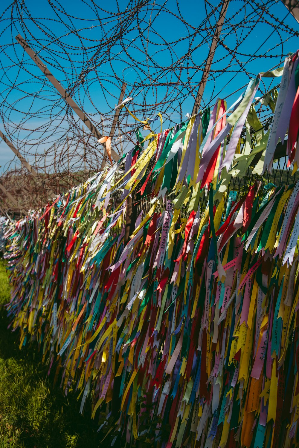 a fence with colorful flags