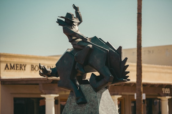 a statue of a person holding a gun