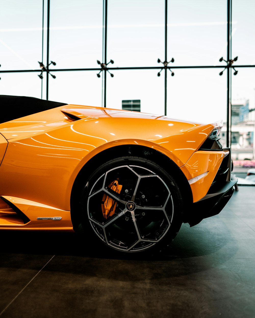 a shiny orange sports car