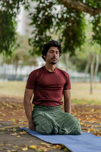 a person sitting on a mat