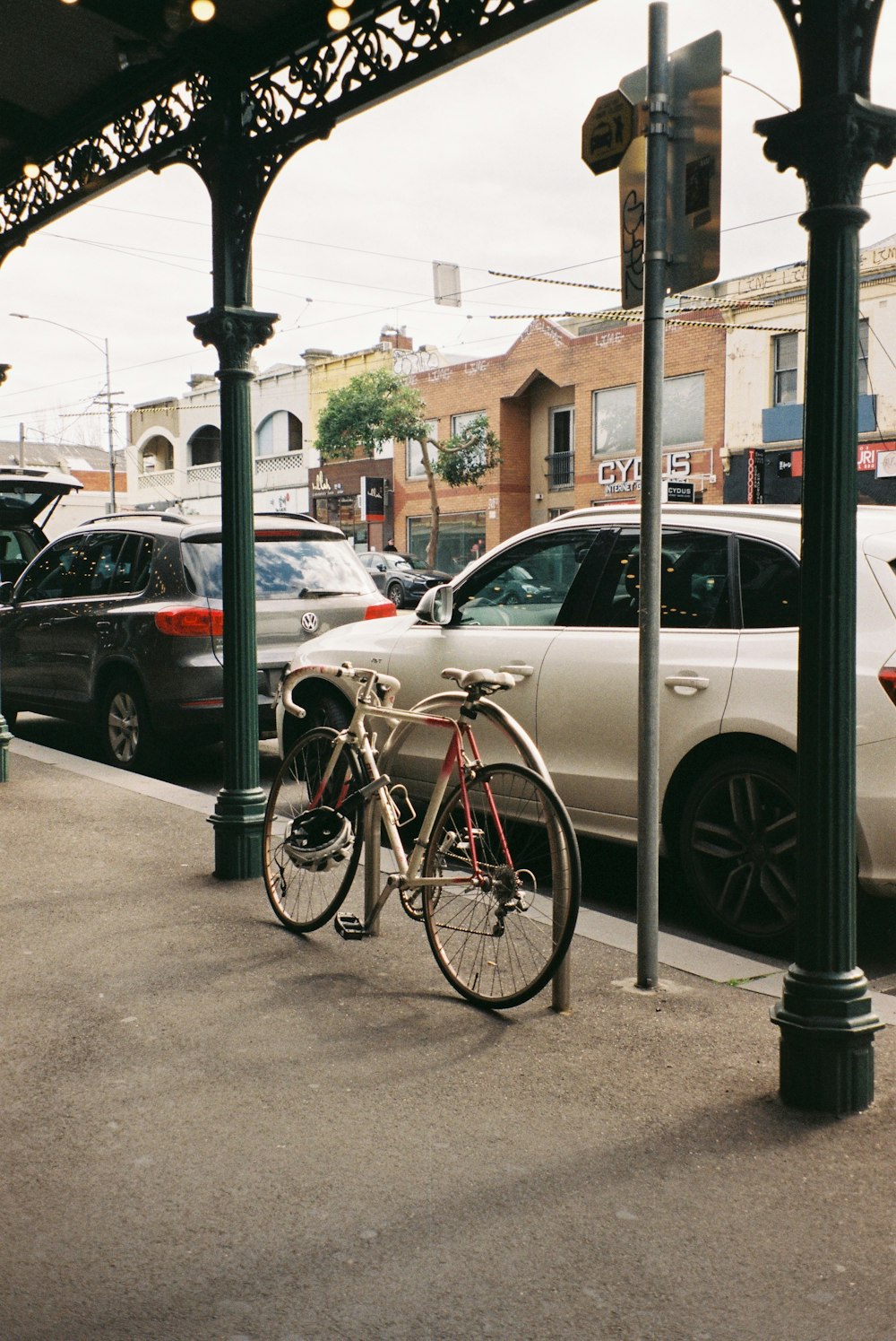 a bicycle is parked on the side of a street
