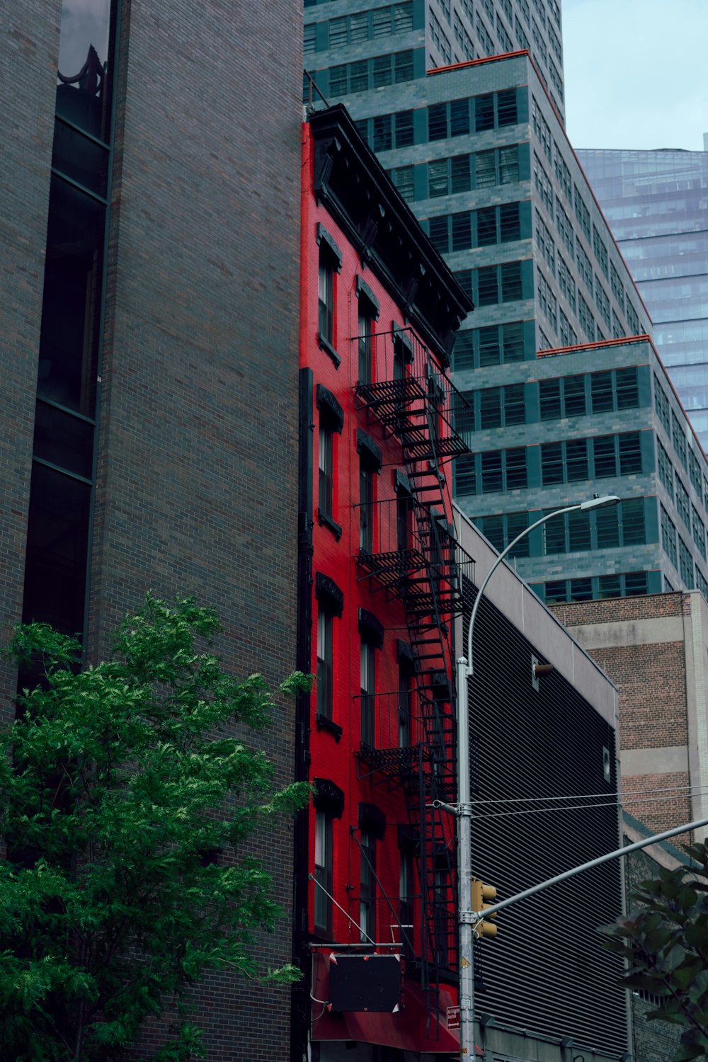 a red ladder next to a building