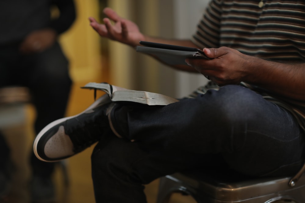 a person lying on the ground with a phone in their hand