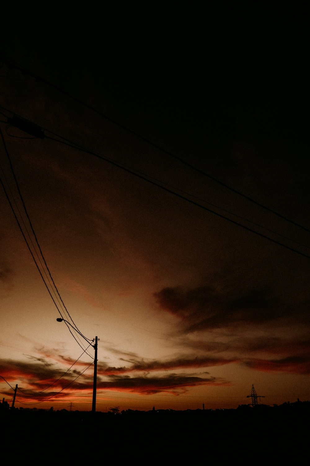 a sunset with power lines