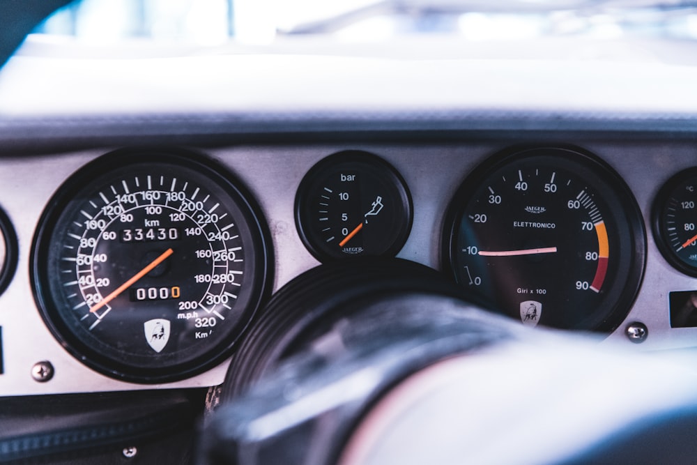 a car dashboard with gauges