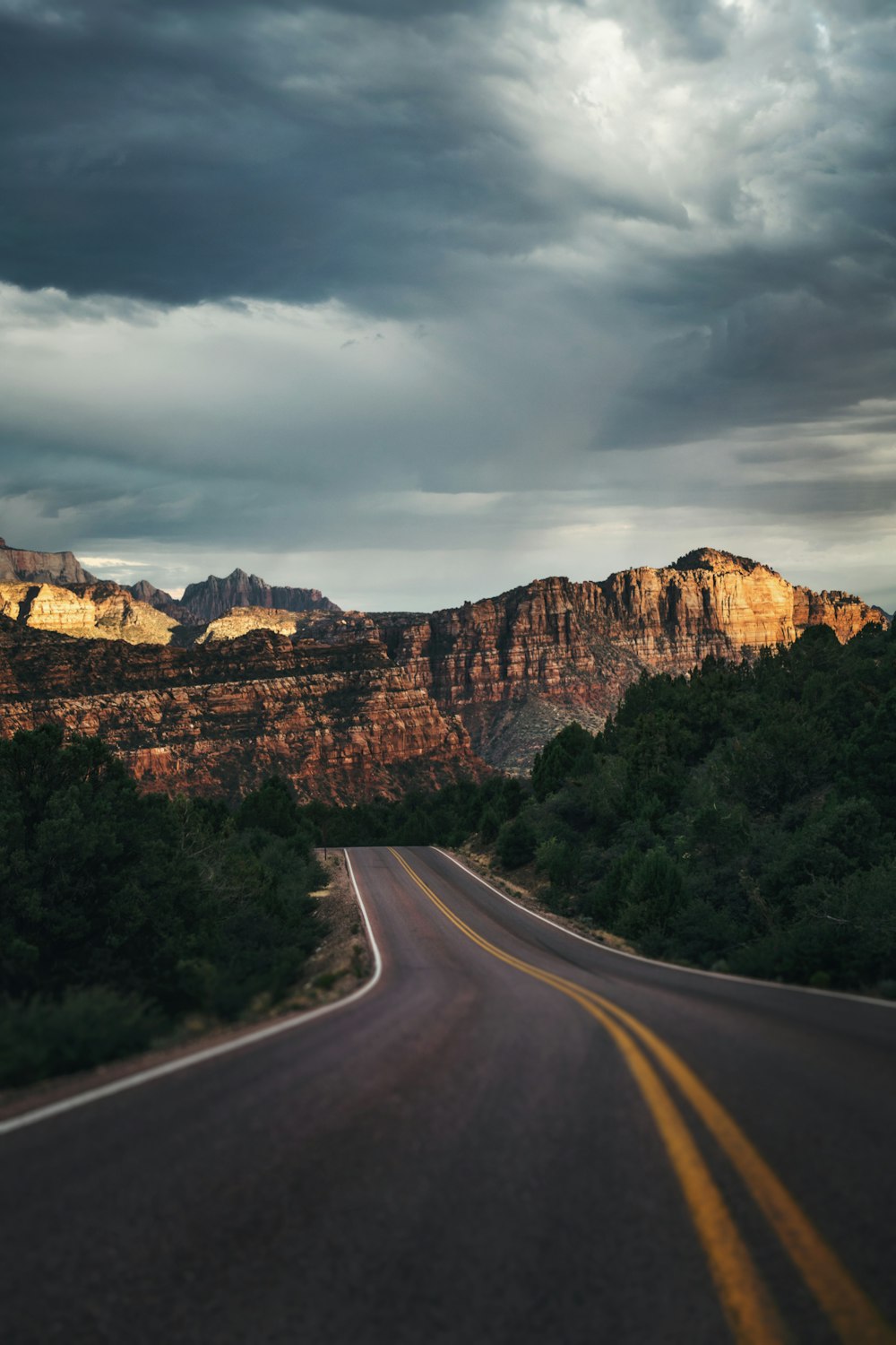 a road leading to a rocky mountain