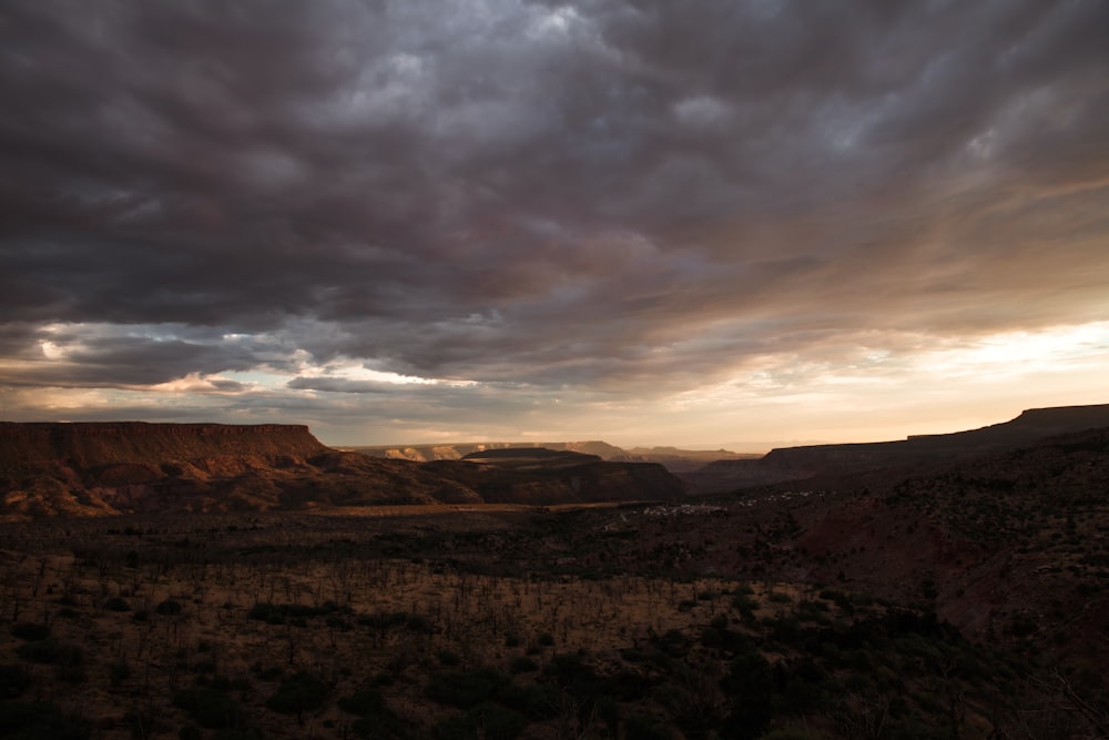 a landscape with hills and clouds