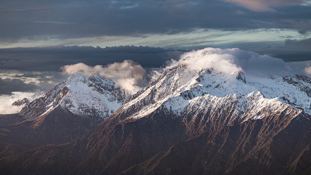 a mountain range with clouds