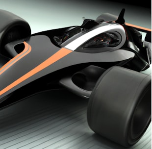 A sleek, futuristic race car with a streamlined design and matte black and orange accents. The vehicle features large wheels and an aerodynamic body, emphasizing speed and modernity.
