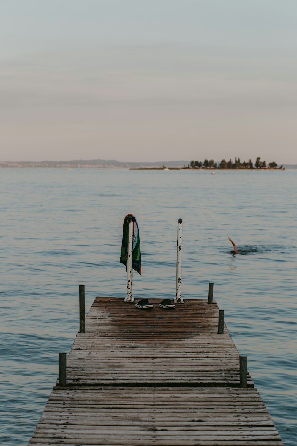 a dock with a boat in the water