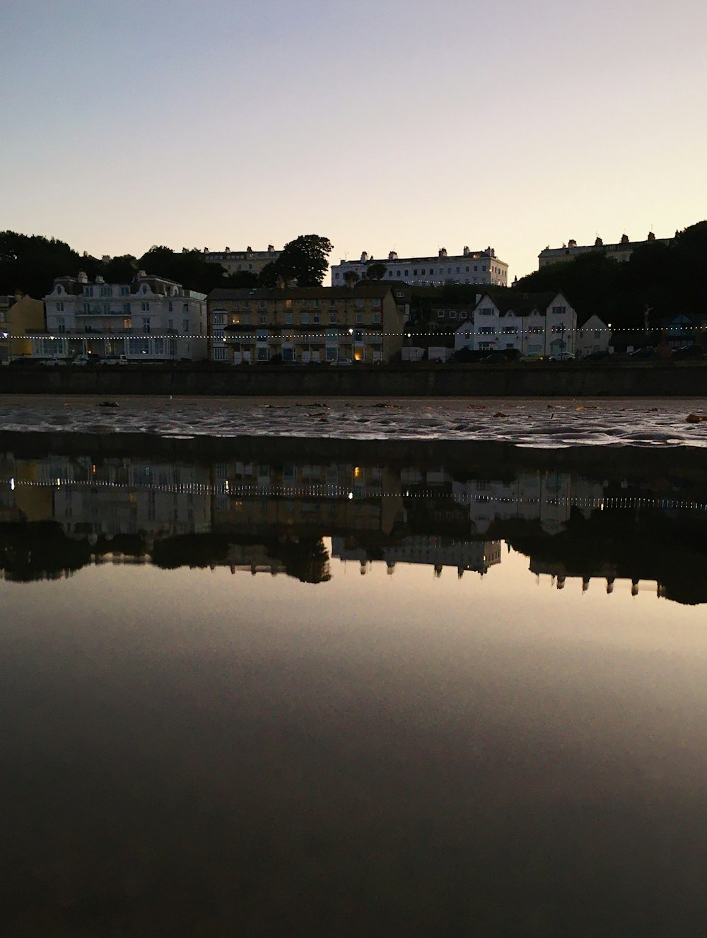 a body of water with buildings along it