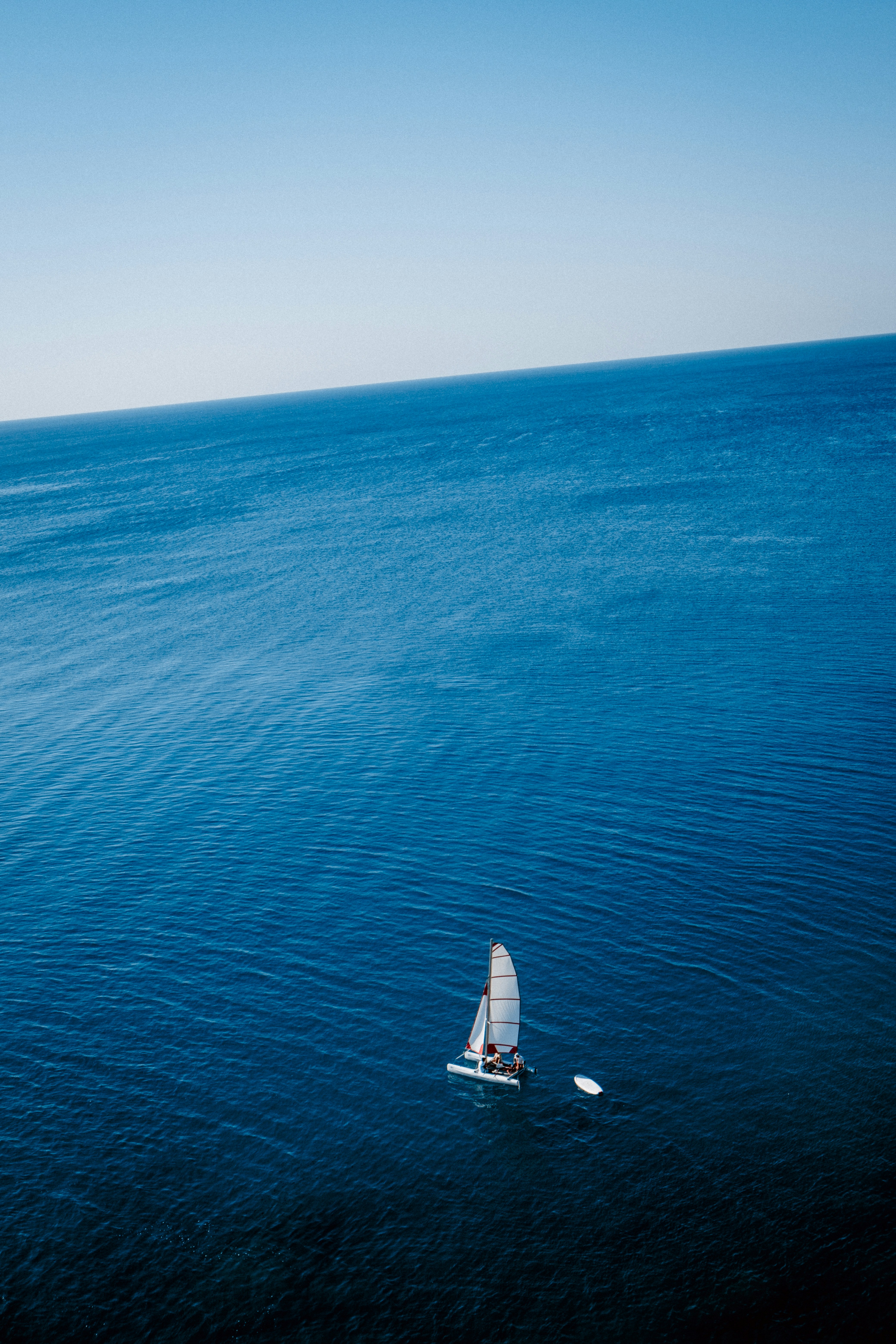 a couple of sailboats on the water