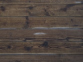 a wood surface with a hole in it