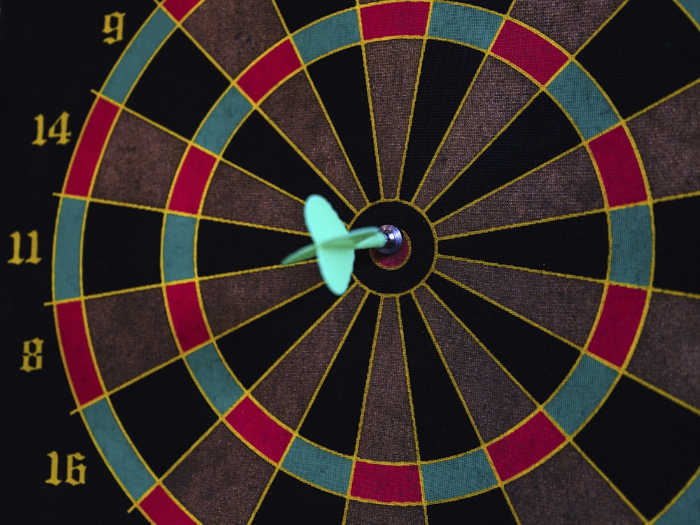 a dart board with darts