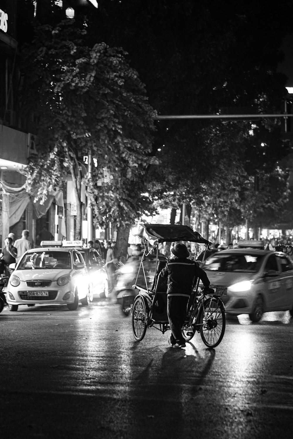 a person riding a bicycle with an umbrella on a rainy day