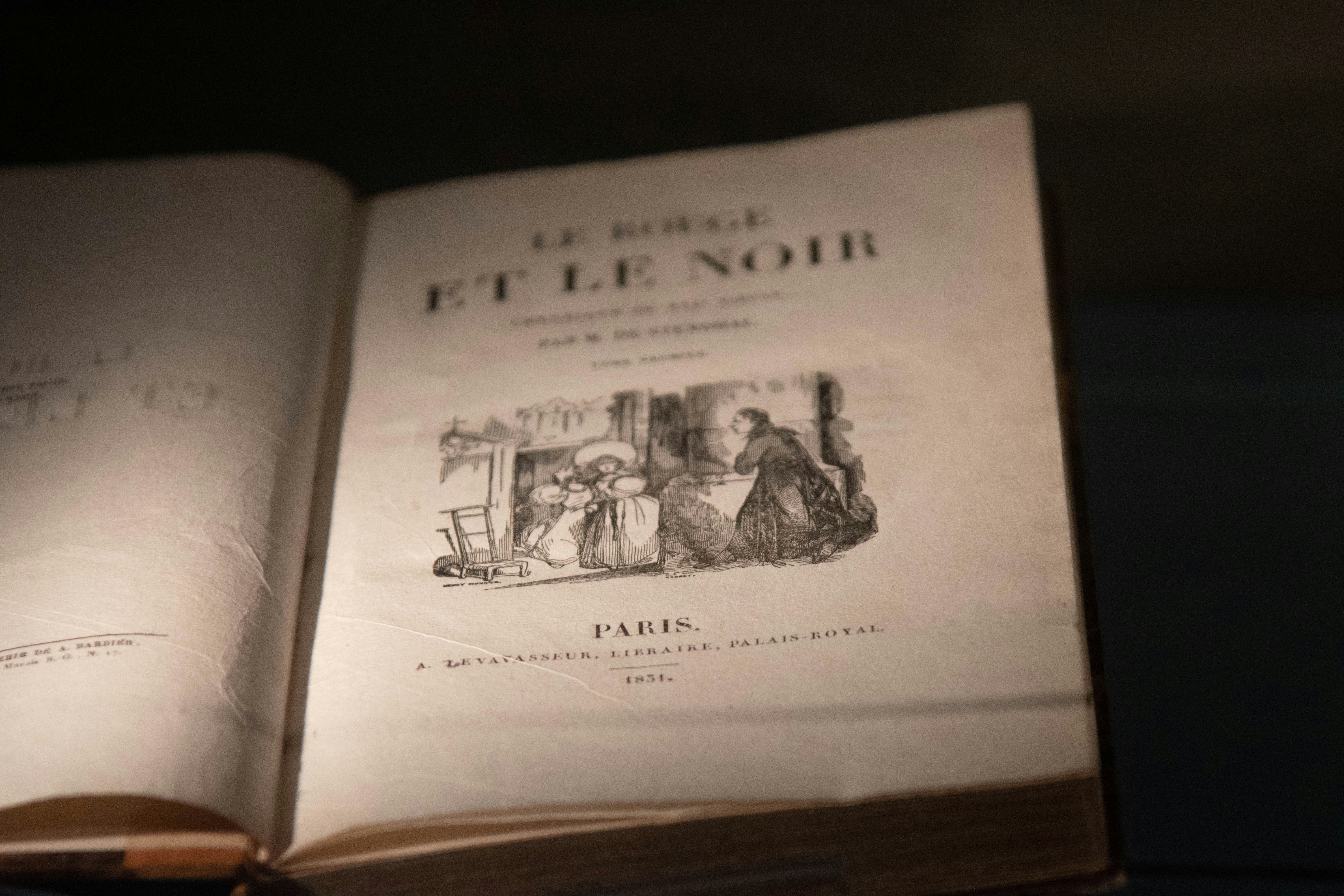 a book open to a page with a page that has a picture of people on it