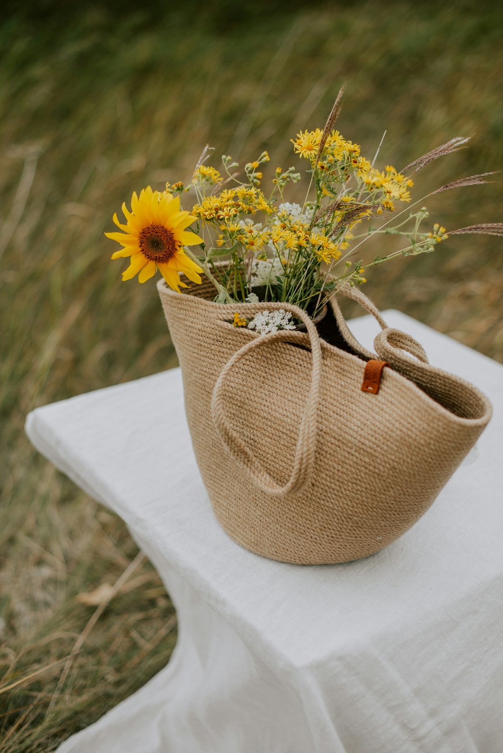 a vase with yellow flowers