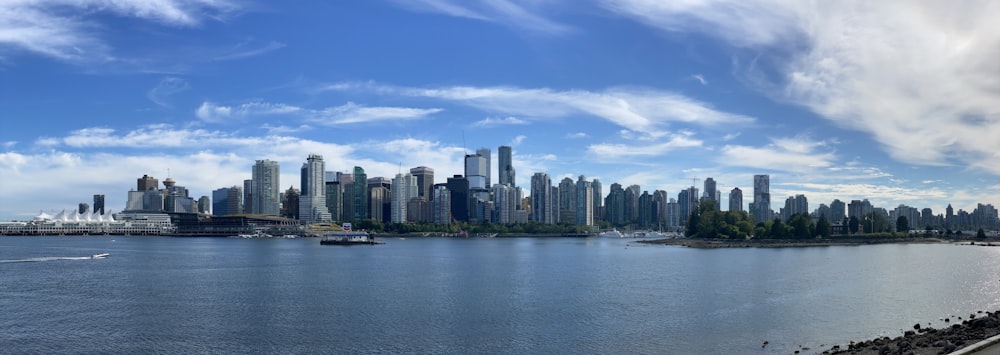 a city skyline across a body of water