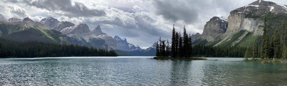 a lake with mountains in the background