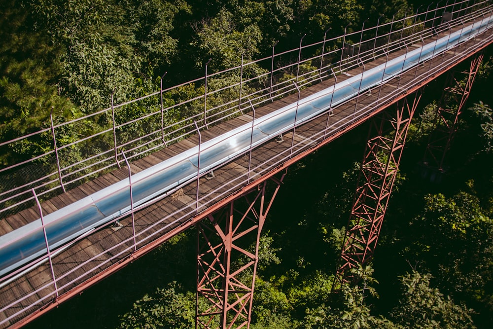 a bridge with a red railing